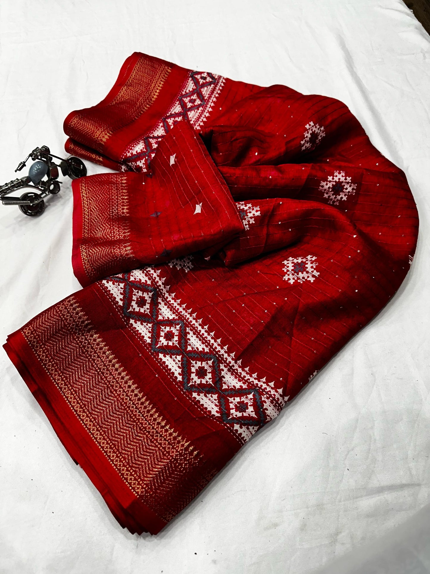 Beautiful Benny crape sikvach saree with all over doll design along with scallop maggam
