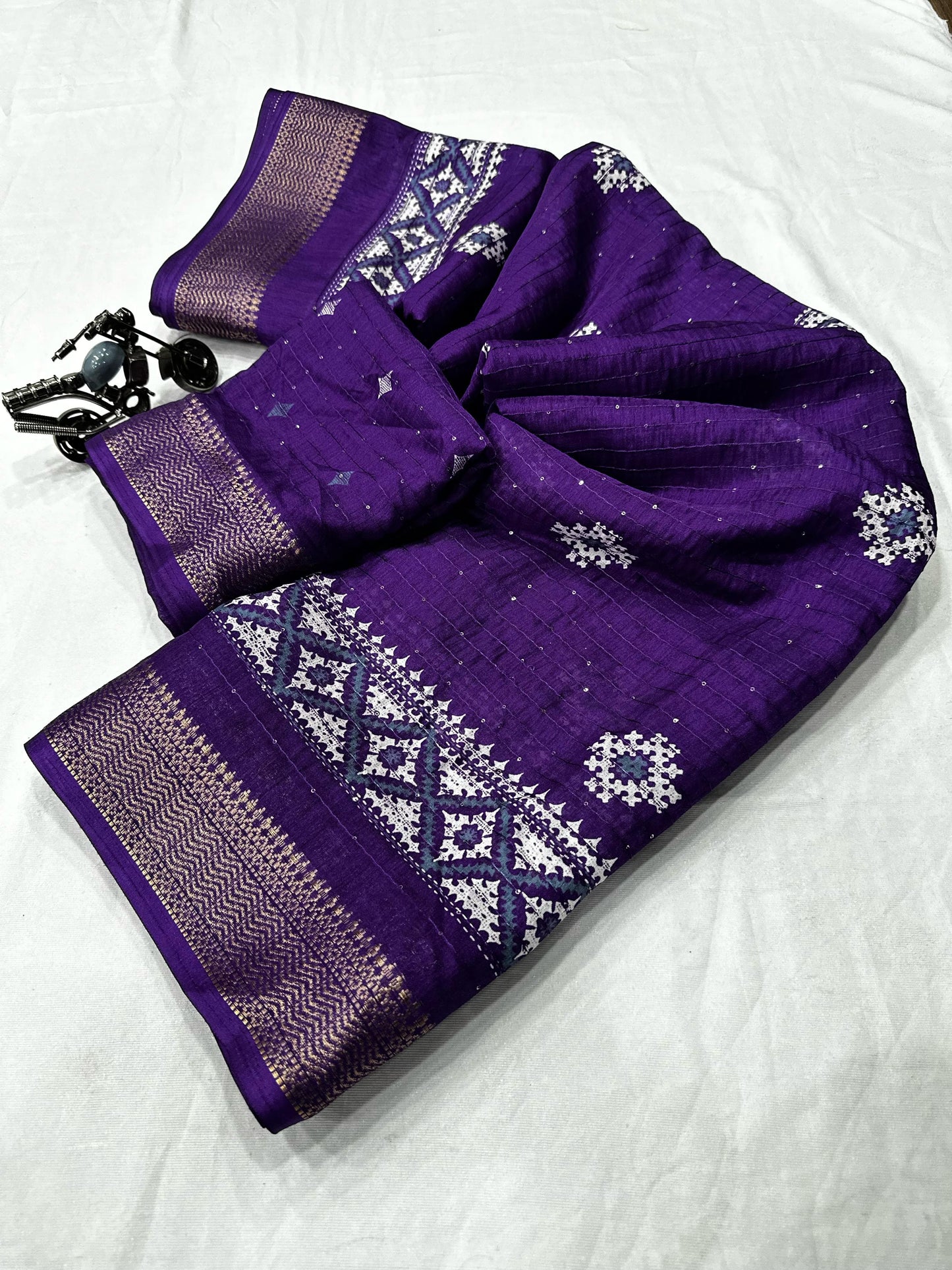 Beautiful Benny crape sikvach saree with all over doll design along with scallop maggam